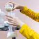 Person pouring breast milk from a bottle to a bag. This article answers the question: can you reheat breast milk?